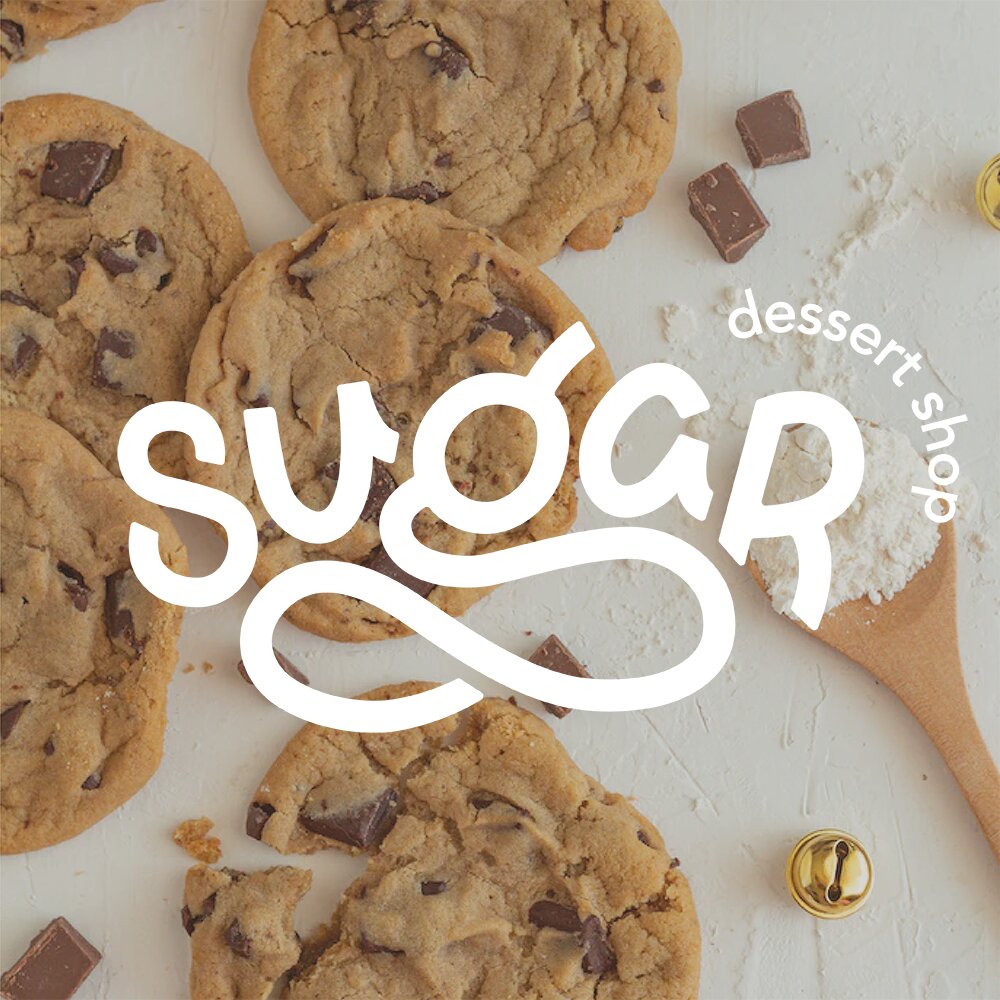 sugar the vegan dessert shop logo overlay onto a photograph of cookies